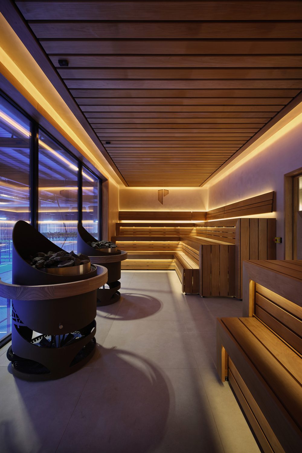 Changing room at Padium Cardiff featuring modern lockers and benches, photographed by Jon Green.