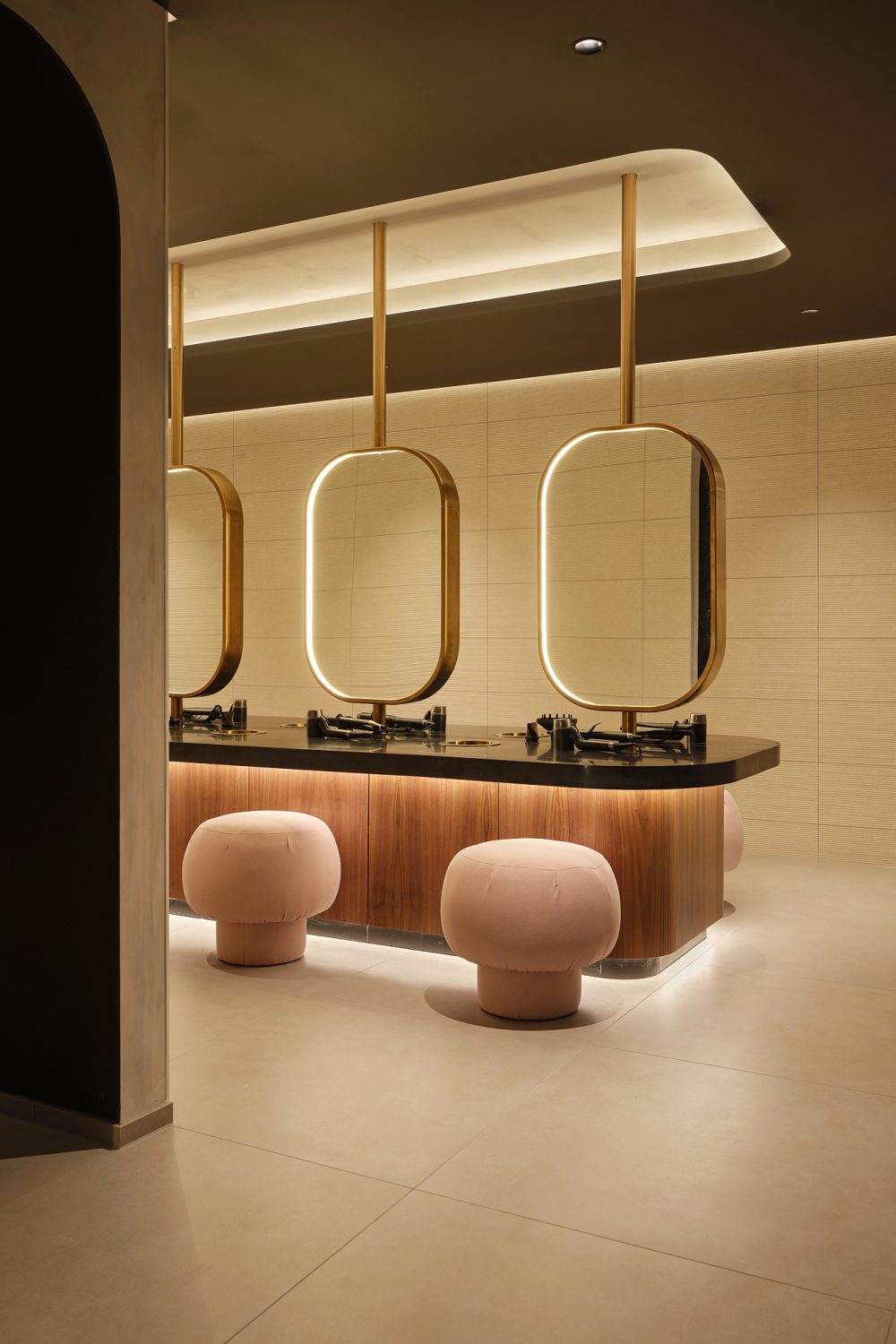 Changing room at Padium Cardiff featuring modern lockers and benches, photographed by Jon Green.