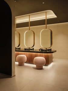 Changing room at Padium Cardiff featuring modern lockers and benches, photographed by Jon Green.